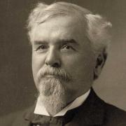 Black and white photographic portrait of Edward S. Ellis (1840-1916), a white man with gray or white hair and a goatee and mustache.