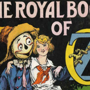 Cover for "The Royal Book of Oz" with a girl with bobbed hair sitting next to a grinning scarecrow with her arm around him.