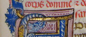 Illuminated medieval capital letter A in blue, gold, and red