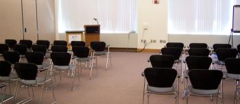 Chairs set up lecture style in Andersen Library 120B