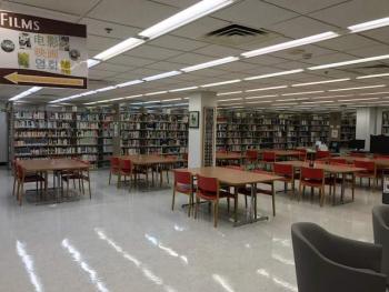 Library space with tables and chairs