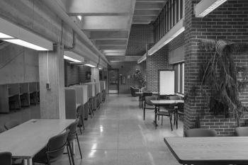 Large space with tables, chairs, and study carrels