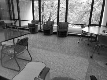 Tables with chairs, individual study seats with laptop tables
